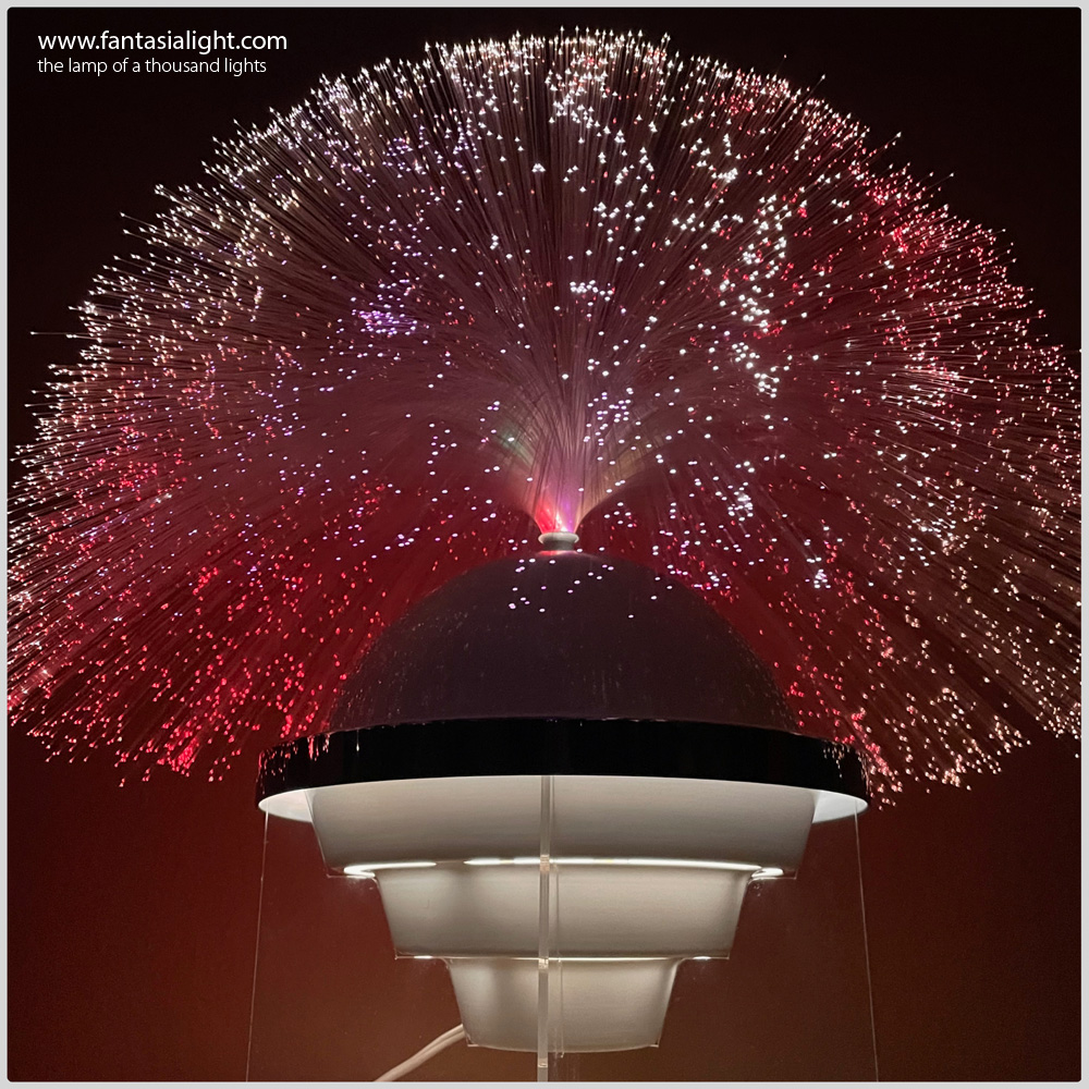 Fantasia Ultra - Model 4007 - This beautiful lamp looks like something straight out of the set of Star Wars. With a beautiful white and clear aesthetic the Fantasia Ultra design looks as if it is levitating above the surface it is placed due to its transparent cut base. Images are the kind courtesy of Dania Pruess.